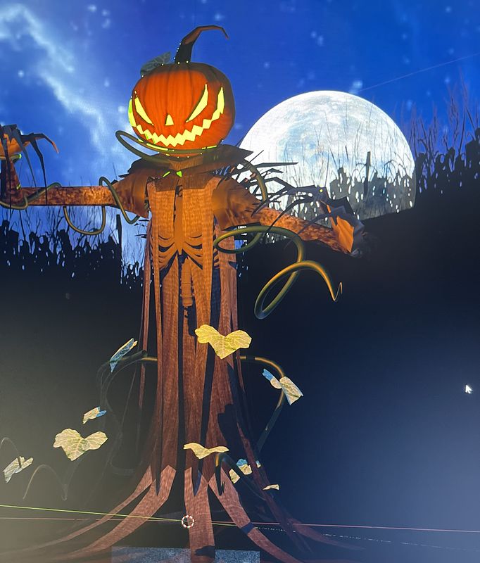 Digital painting of a scarecrow with a glowing carved jack-o'-lantern head, ragged robes and vines under a huge full moon in a deep blue night sky.